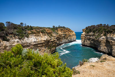 Scenic view of sea against clear blue sky