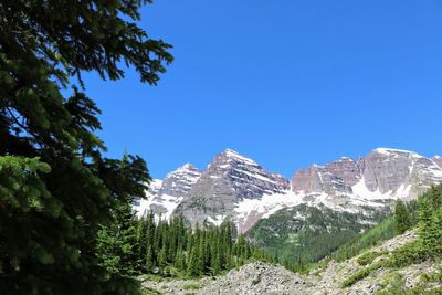 Scenic view of mountains against clear blue sky