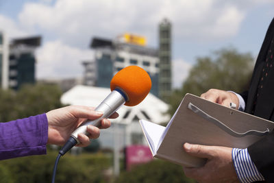 Journalist making media interview with businessman