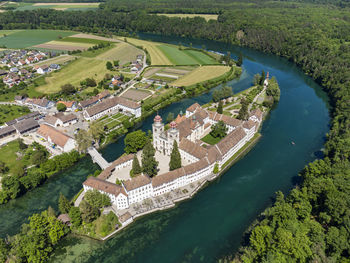 High angle view of river amidst buildings in city