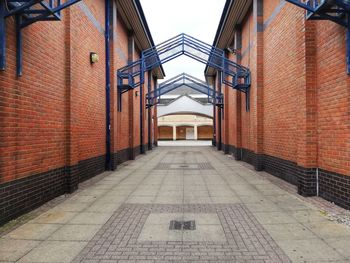 Empty alley along buildings