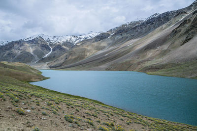 Scenic view of lake and mountains against sky