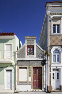 Low angle view of building against clear blue sky