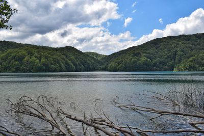 Scenic view of lake and mountains against sky