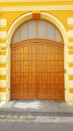 Closed door of yellow building