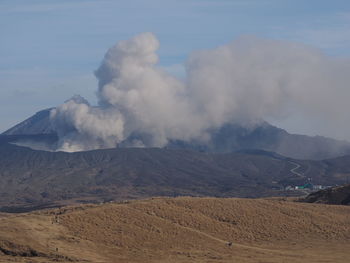 Smoke emitting from volcanic mountain