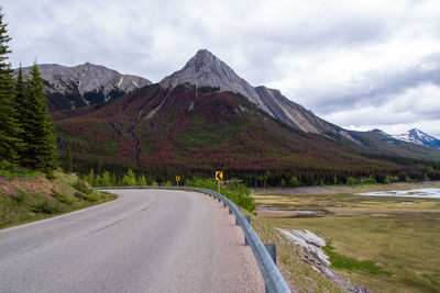 Empty road along countryside landscape