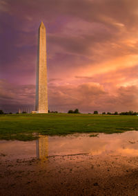 Low angle view of washington monument against cloudy sky at sunset