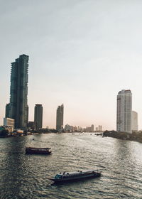 Scenic view of sea and buildings against sky