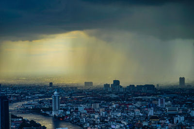 Cityscape against sky during sunset