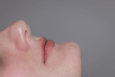 Close-up of human hand against black background