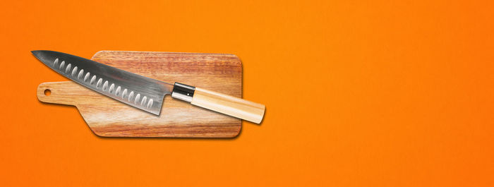 High angle view of text on table against orange background