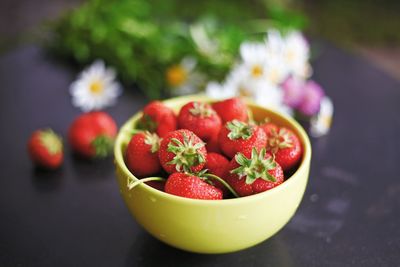 Close-up of strawberries in bowl on table