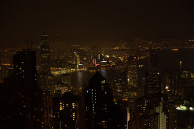 High angle view of illuminated buildings in city at night