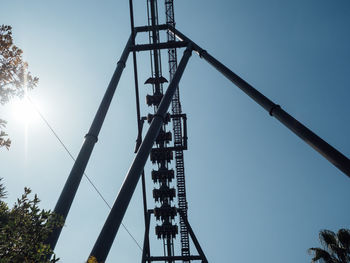 Low angle view of crane against clear sky