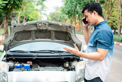 Man standing in car