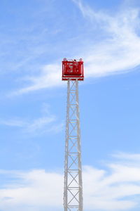 People on ride at tibidabo amusement park against sky