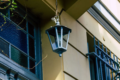 Low angle view of street light against building