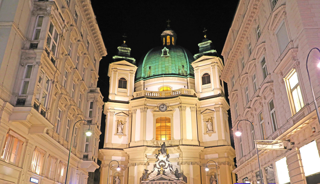 LOW ANGLE VIEW OF ILLUMINATED BUILDING