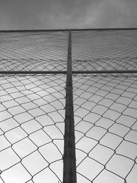 Low angle view of chainlink fence