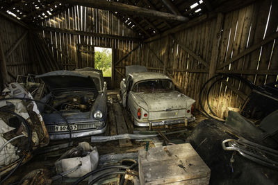 Abandoned cars in barn