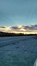 Scenic view of landscape against sky at sunset