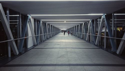 Man standing on corridor of building