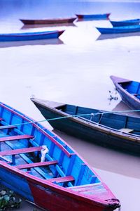 View of boats in calm blue sea