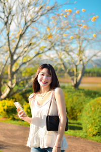 Young woman using mobile phone