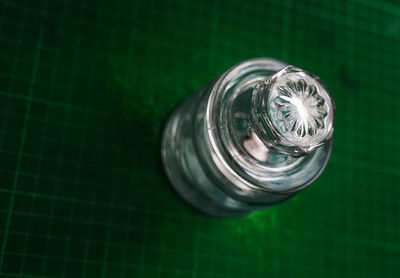 High angle view of glass bottle on table