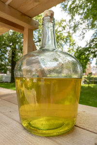 Close-up of glass bottle on table