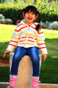 Portrait of girl standing on field