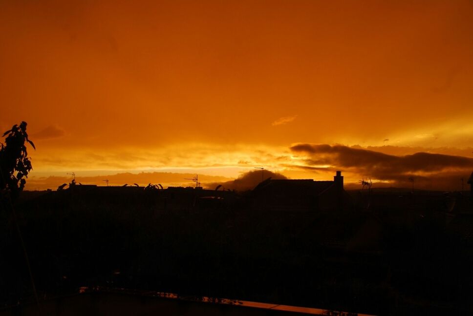 sunset, silhouette, orange color, sky, building exterior, built structure, architecture, house, cloud - sky, beauty in nature, scenics, dramatic sky, nature, residential structure, cloud, dark, landscape, dusk, outdoors, tranquility