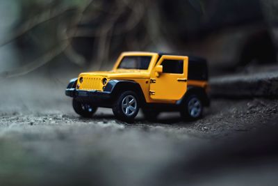 Close-up of toy car on road
