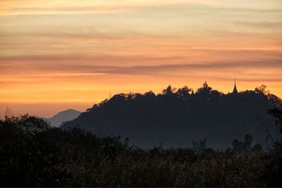 Scenic view of silhouette trees against sky during sunset