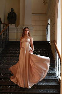 Young woman on staircase