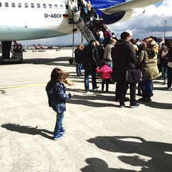 Rear view of woman on road