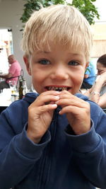 Portrait of boy eating food in restaurant