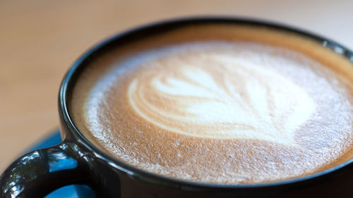 High angle view of cappuccino on table