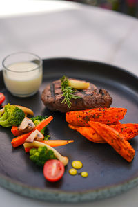 Close-up of food in plate on table