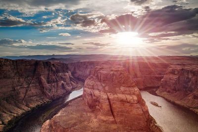 Scenic view of desert against sky during sunset