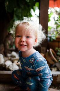 Portrait of cute boy smiling outdoors