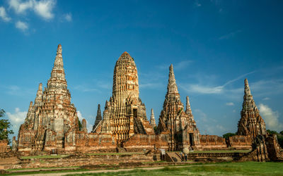 Low angle view of temple against cloudy sky at ayuthaya