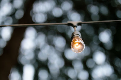 Low angle view of illuminated light bulb