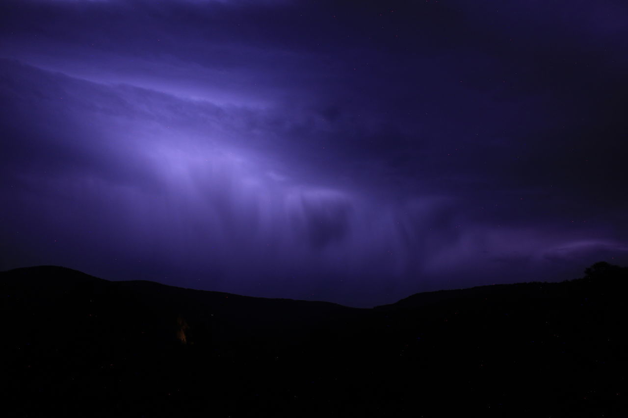 sky, beauty in nature, night, cloud, scenics - nature, mountain, environment, darkness, dramatic sky, storm, landscape, silhouette, dark, power in nature, nature, thunderstorm, no people, lightning, awe, star, thunder, storm cloud, mountain range, outdoors, tranquility, purple, atmospheric mood, tranquil scene