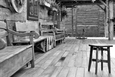 Stool by benches at porch