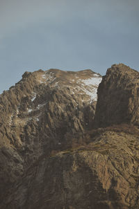 Low angle view of rock formations against sky