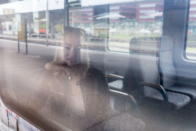 Portrait of man looking through window