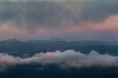 Scenic view of mountains against sky during sunset