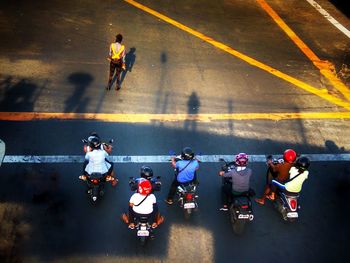 High angle view of people walking on road